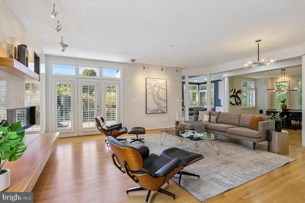 1460 Waterfront Road Reston, VA 20194 - Photo 12 of 59 a living room with fireplace furniture and a table