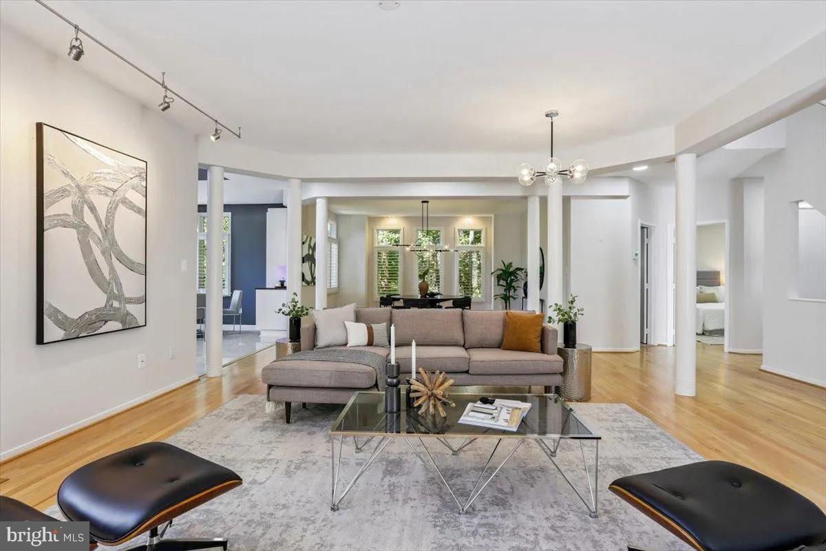 1460 Waterfront Road Reston, VA 20194 - Photo 15 of 59 a living room with furniture and a chandelier