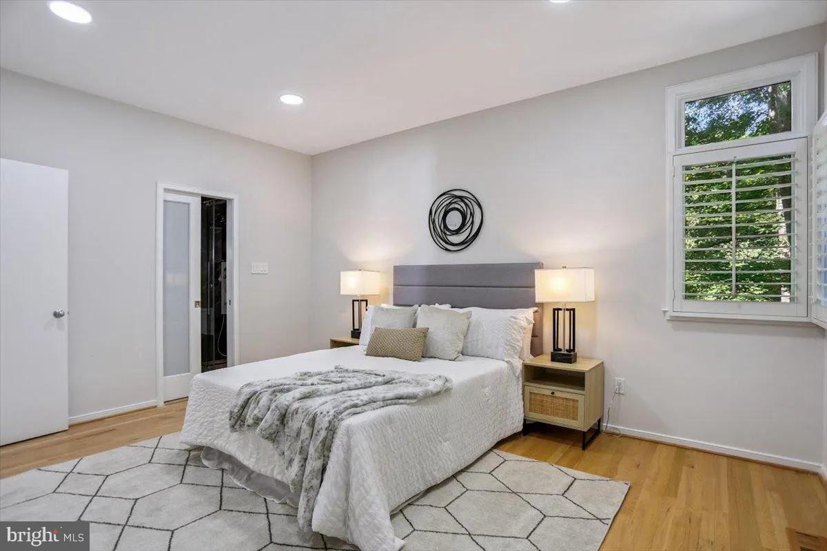 1460 Waterfront Road Reston, VA 20194 - Photo 23 of 59 a bedroom with a bed and a window