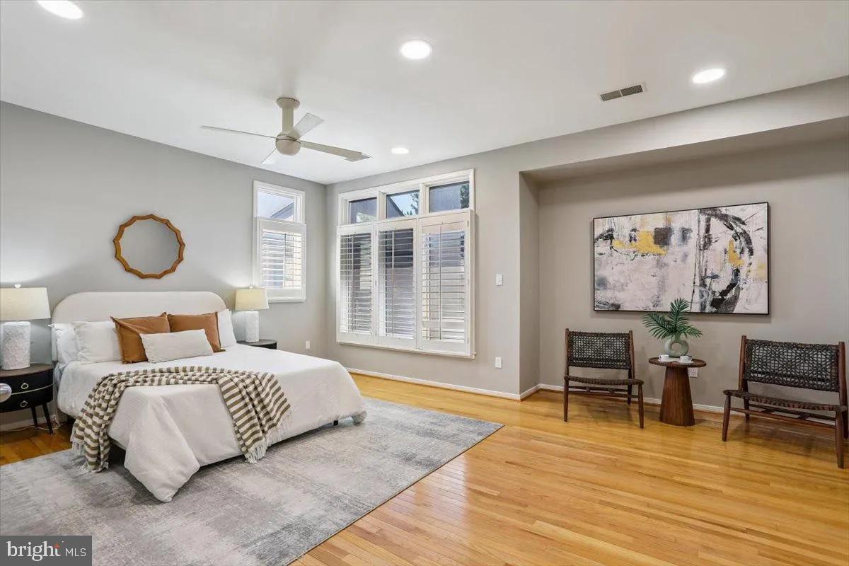 1460 Waterfront Road Reston, VA 20194 - Photo 28 of 59 a bedroom with a bed and wooden floor