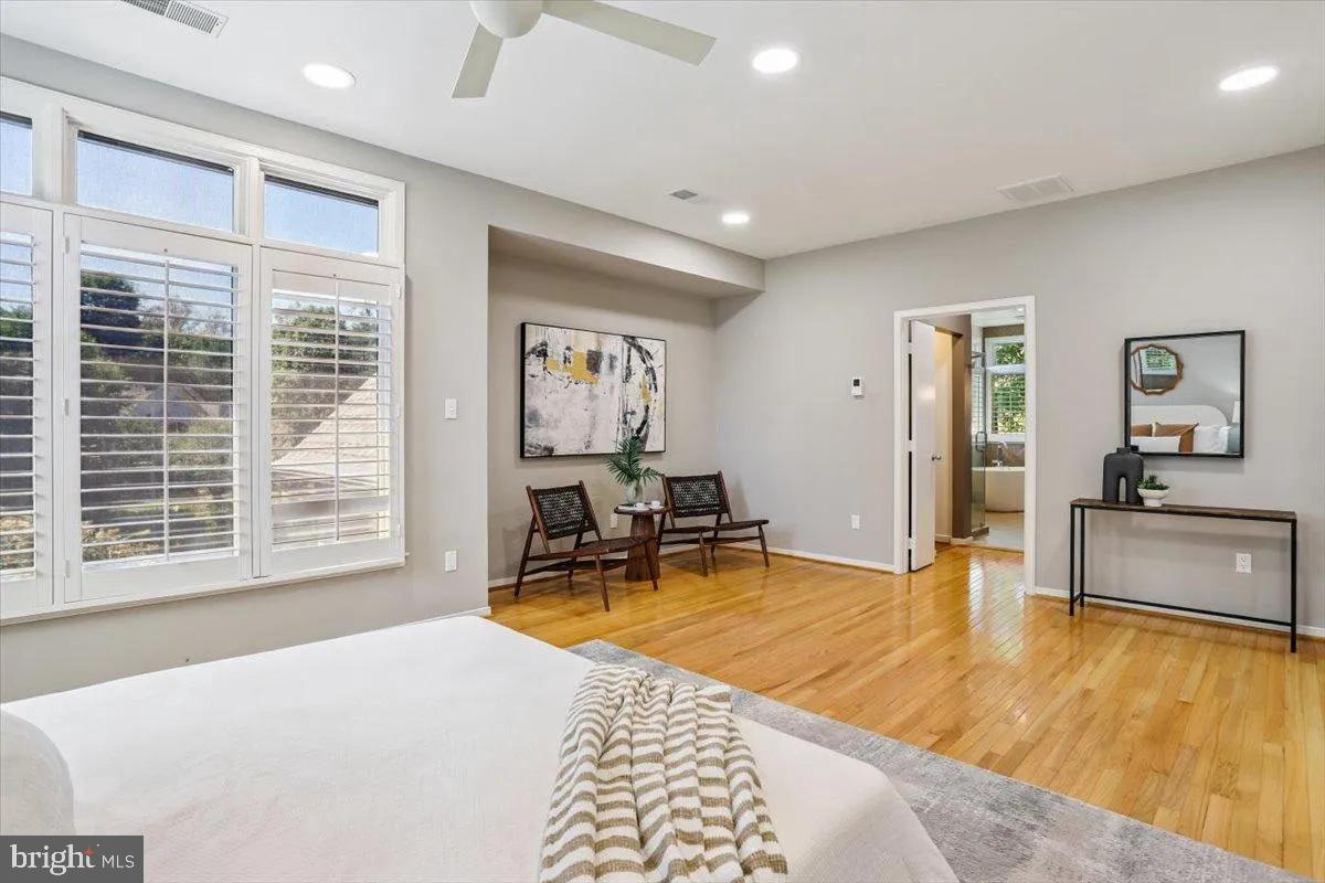 1460 Waterfront Road Reston, VA 20194 - Photo 29 of 59 a bedroom with a bed and a table in it