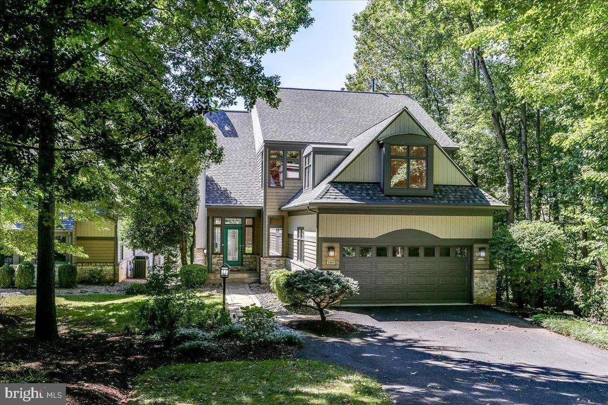1460 Waterfront Road Reston, VA 20194 - Photo 3 of 59 a front view of a house with a yard
