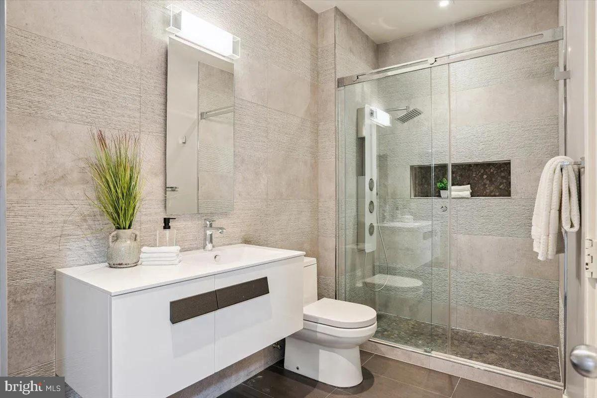 1460 Waterfront Road Reston, VA 20194 - Photo 36 of 59 a bathroom with a sink and a mirror