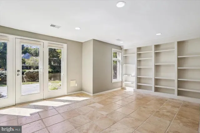 a view of a roof deck with wooden floor and fence