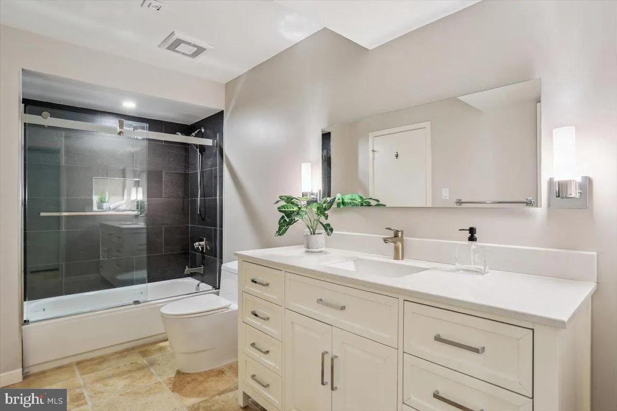 1460 Waterfront Road Reston, VA 20194 - Photo 48 of 59 a bathroom with a sink a toilet and shower