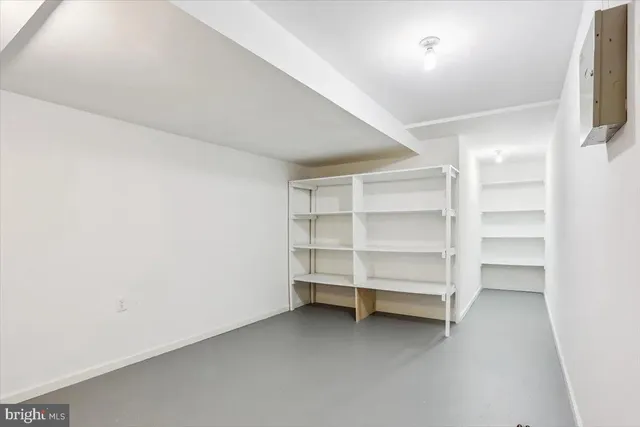 a front view of a house with a yard garage and outdoor seating