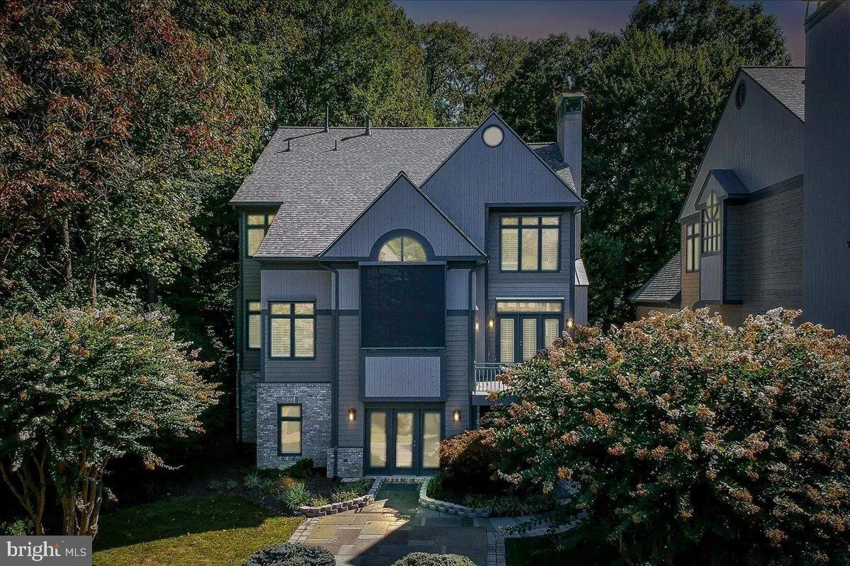 1460 Waterfront Road Reston, VA 20194 - Photo 56 of 59 a front view of a house with a yard garage and outdoor seating