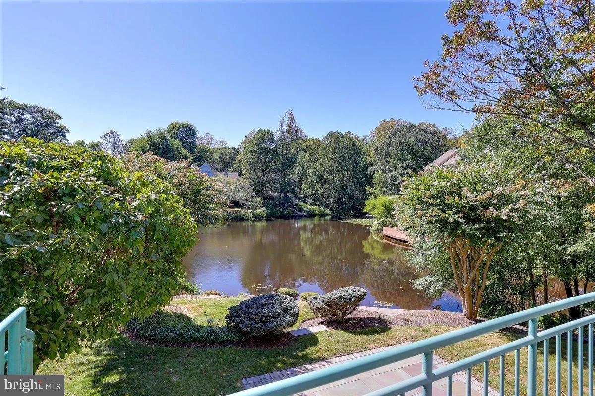 1460 Waterfront Road Reston, VA 20194 - Photo 7 of 59 a view of a lake with a mountain in the background