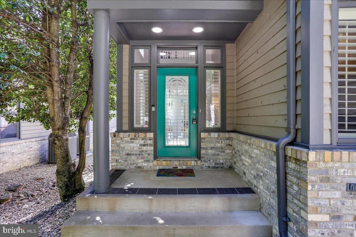 1460 Waterfront Road Reston, VA 20194 - Photo 9 of 59 a front view of a house with a garden