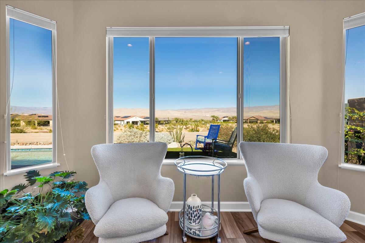 97 Zinfandel Rancho Mirage, CA 92270 - Photo 25 of 68 a living room with furniture potted plant and a window