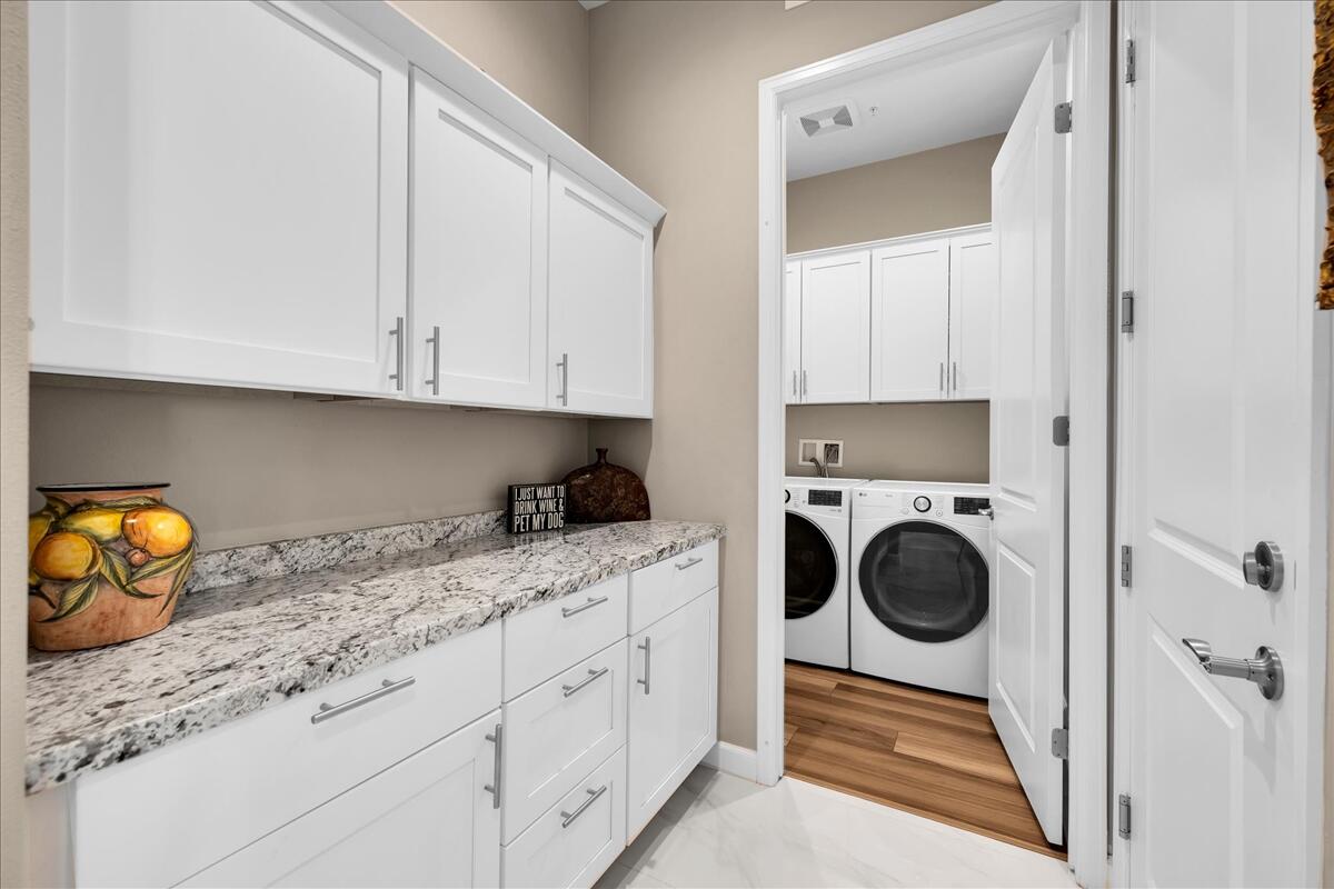 97 Zinfandel Rancho Mirage, CA 92270 - Photo 27 of 50 a utility room with sink dryer and washer