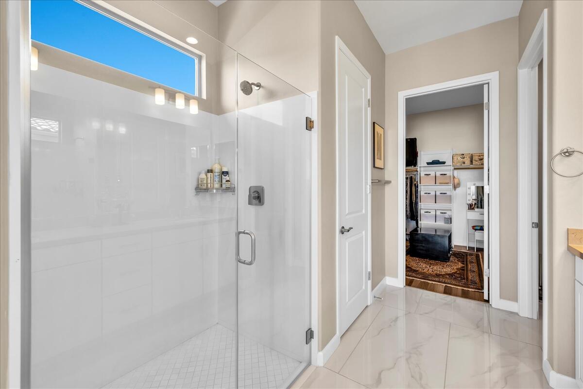 97 Zinfandel Rancho Mirage, CA 92270 - Photo 28 of 68 a bathroom with a glass shower door