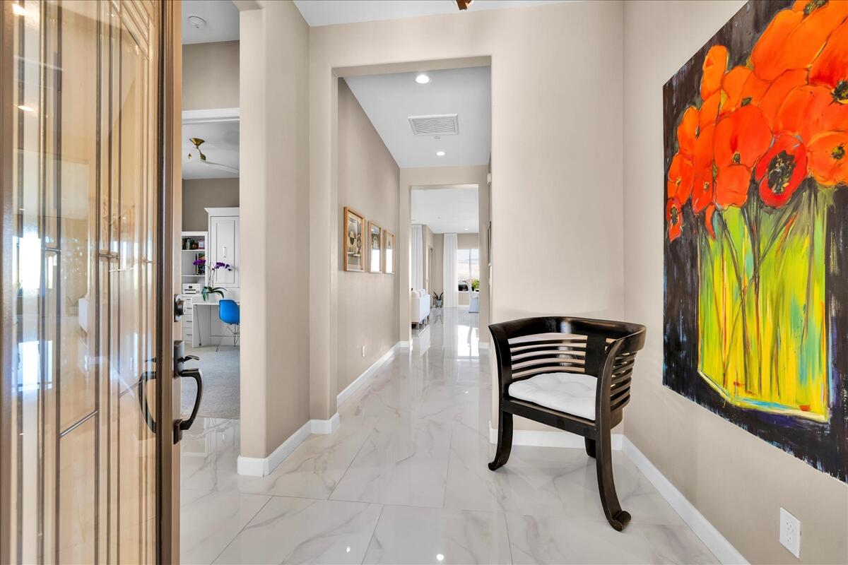 97 Zinfandel Rancho Mirage, CA 92270 - Photo 7 of 50 a view of a hallway with furniture and a window