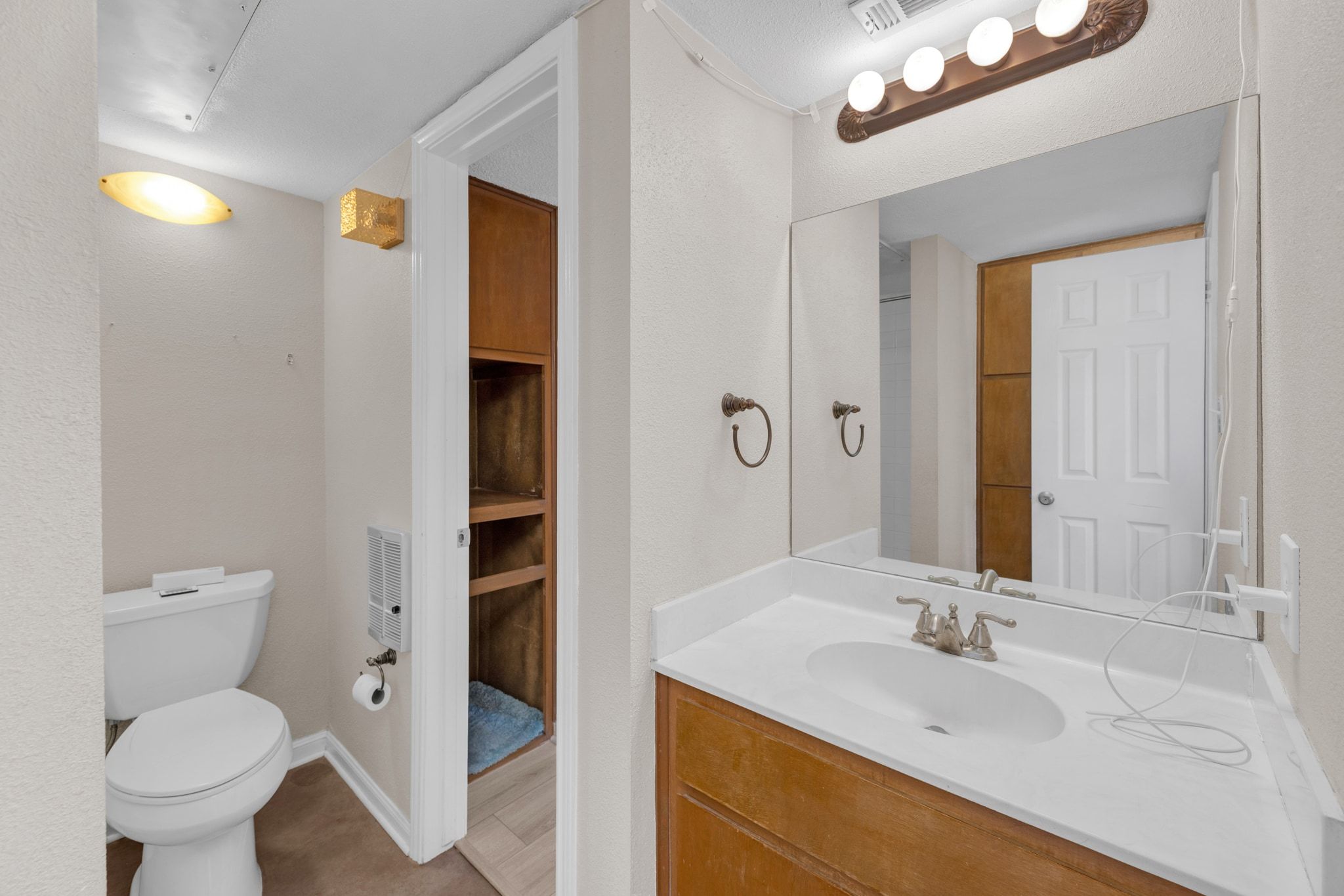 9226 Jollyville Road, Unit 280 Austin, TX 78759 - Photo 25 of 26 Alternate view of the bathroom showcasing generous counter space, updated fixtures, and a functional layout with easy access from the bedroom.