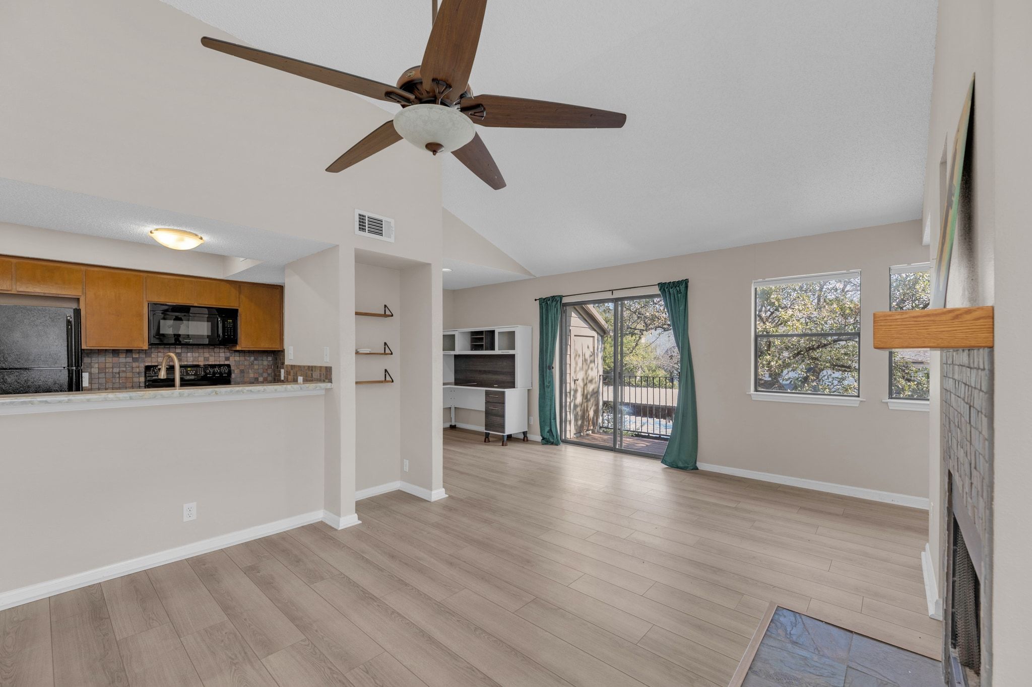 9226 Jollyville Road, Unit 280 Austin, TX 78759 - Photo 10 of 26 Flexible living space with sliding glass doors that bring in natural light and open to the private balcony.