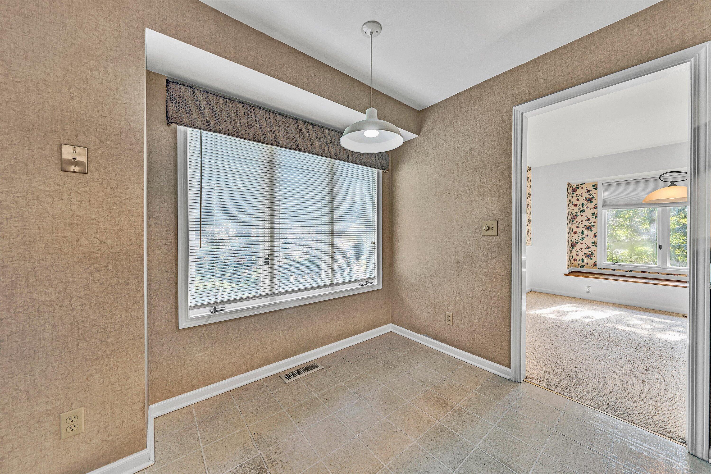 3318 One Oak Road Roanoke, VA 24018 - Photo 17 of 43 an empty room with windows and outdoor view