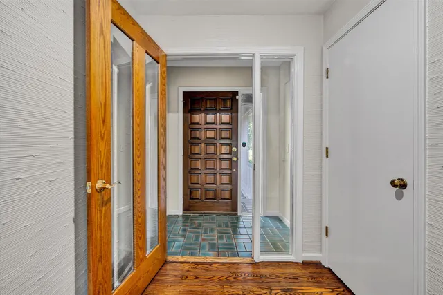 a view of walk in closet with empty room