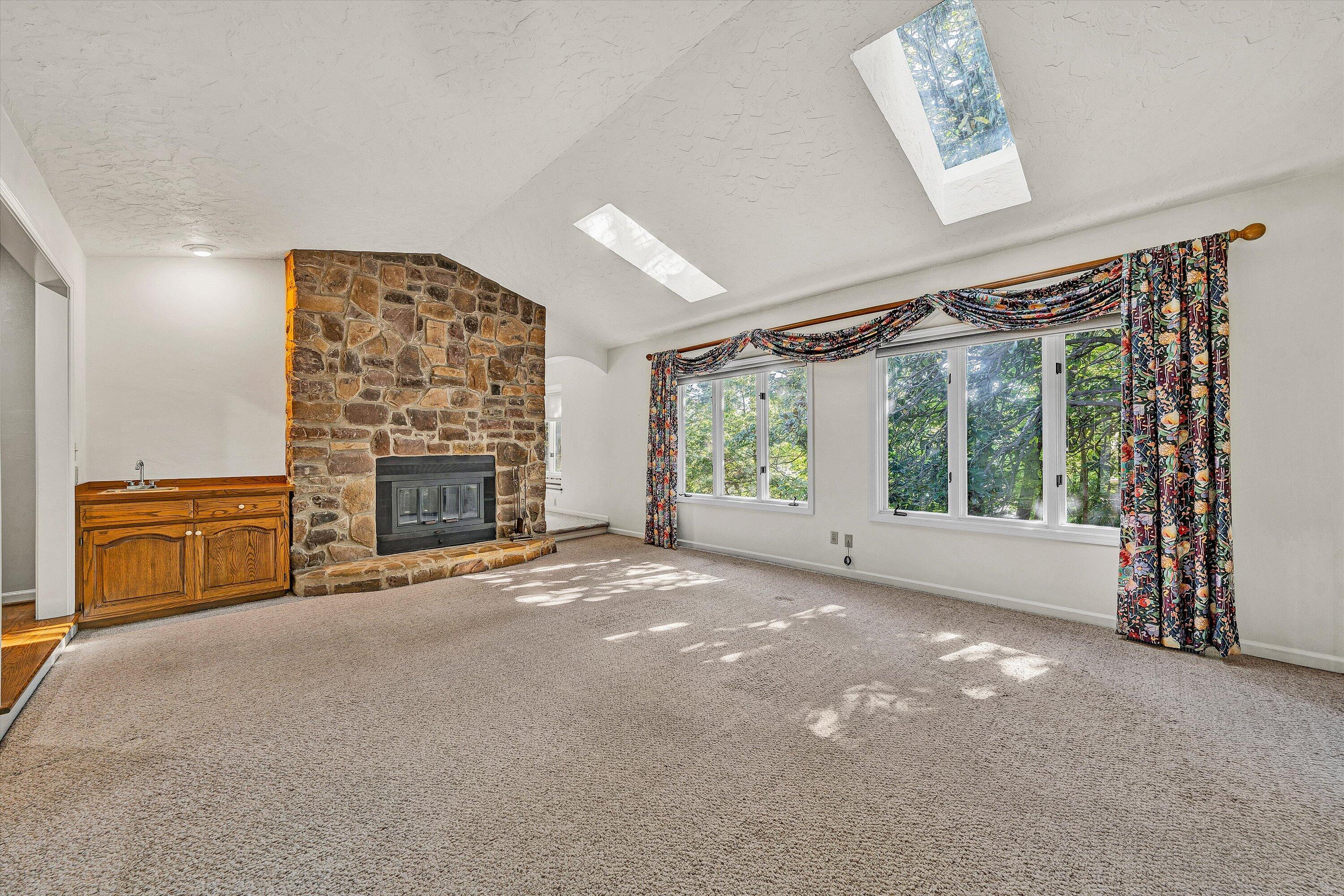 3318 One Oak Road Roanoke, VA 24018 - Photo 5 of 43 a view of an empty room with a fireplace and a window