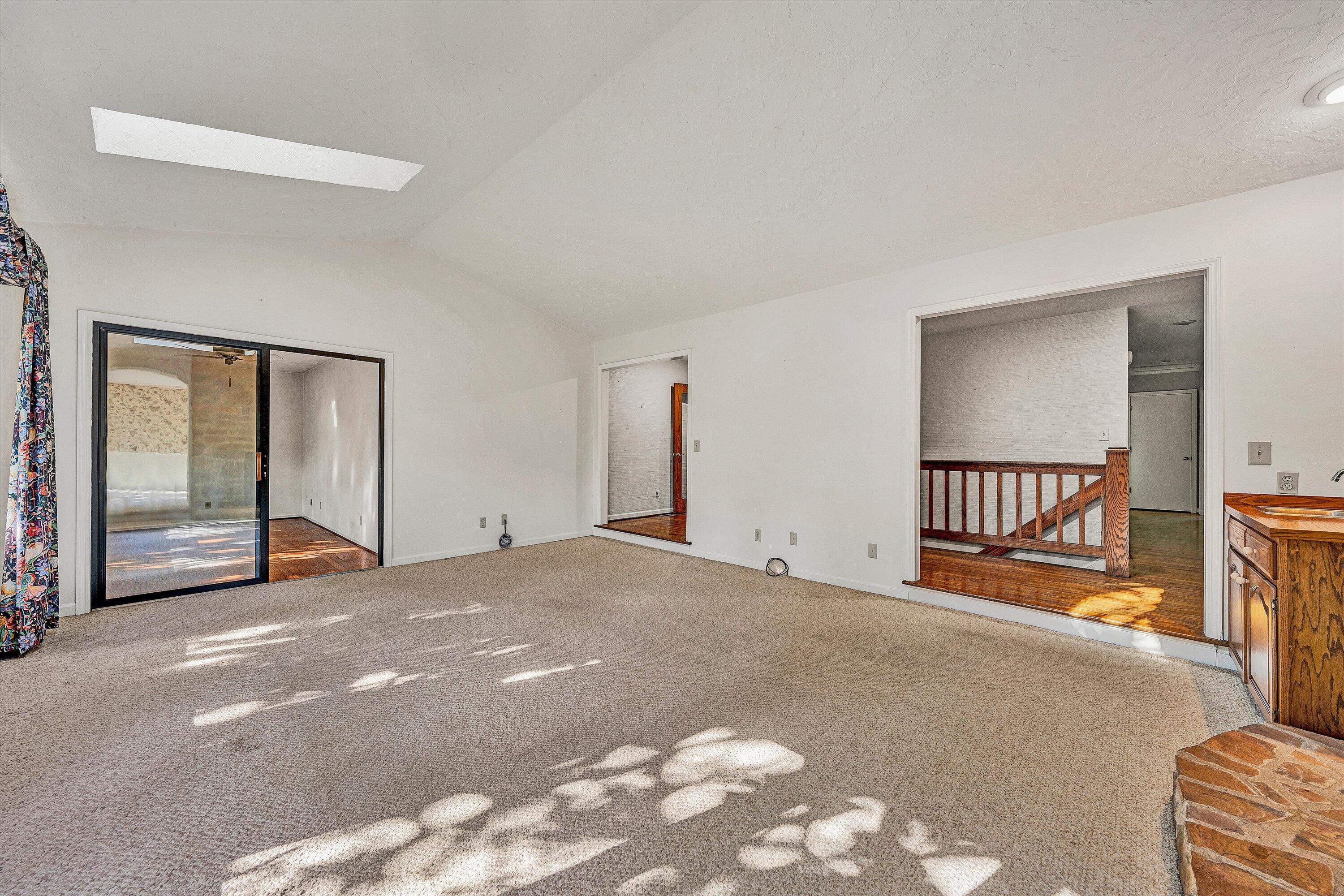 3318 One Oak Road Roanoke, VA 24018 - Photo 6 of 43 a view of an empty room with window and a kitchen