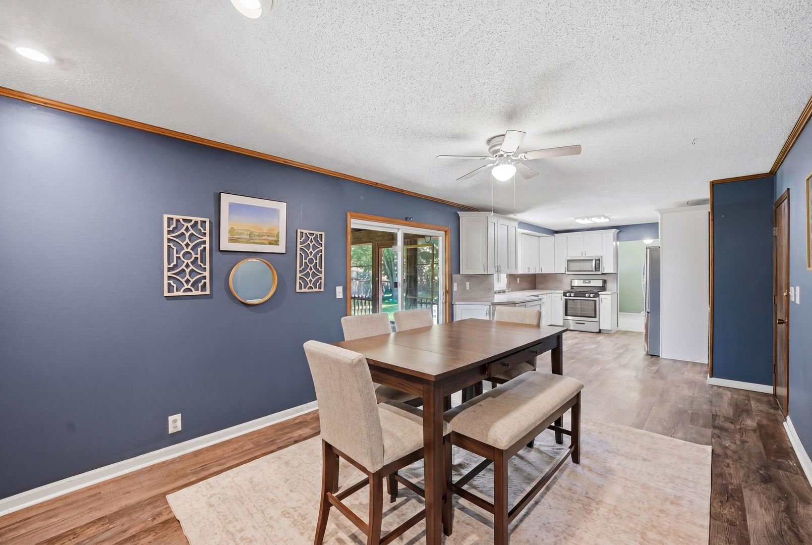 5645 Beebe Drive Rochelle, IL 61068 - Photo 17 of 43 a dining room with a wooden table and chairs