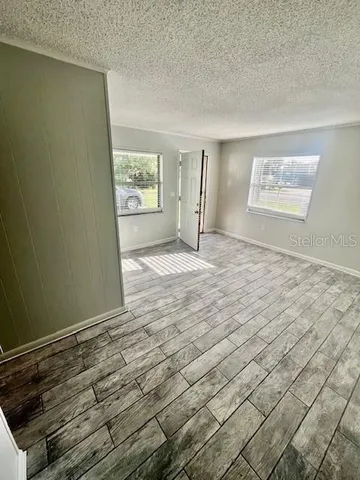 a view of an empty room with a window