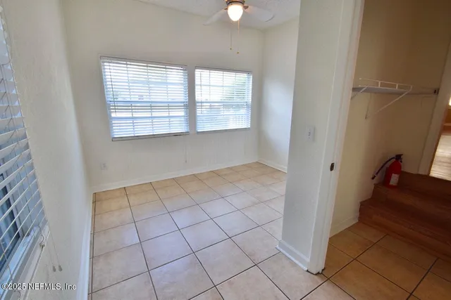 a view of an empty room with windows