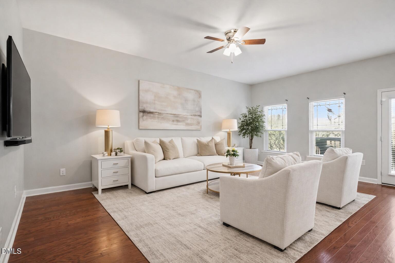 4818 Landover Bluff Way Raleigh, NC 27616 - Photo 14 of 30 a living room with furniture a chandelier and a flat screen tv