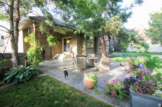 288 525 South Providence, UT 84332 - Photo 47 of 71 View of patio with an outdoor living space with a fire pit