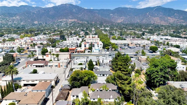 a view of a city with mountains in the background