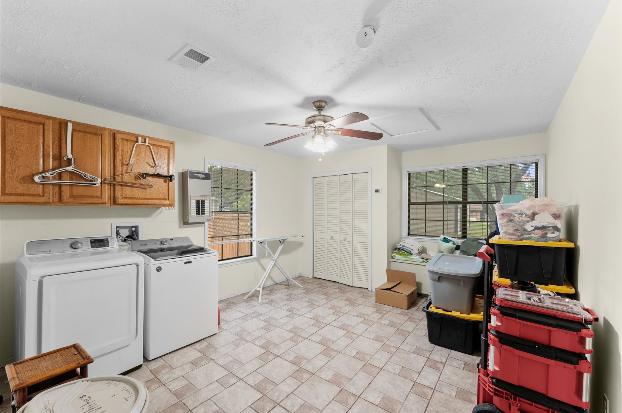 22634 Park Road Tomball, TX 77377 - Photo 23 of 29 Spacious laundry room with modern appliances, ample storage, and large windows for natural light.