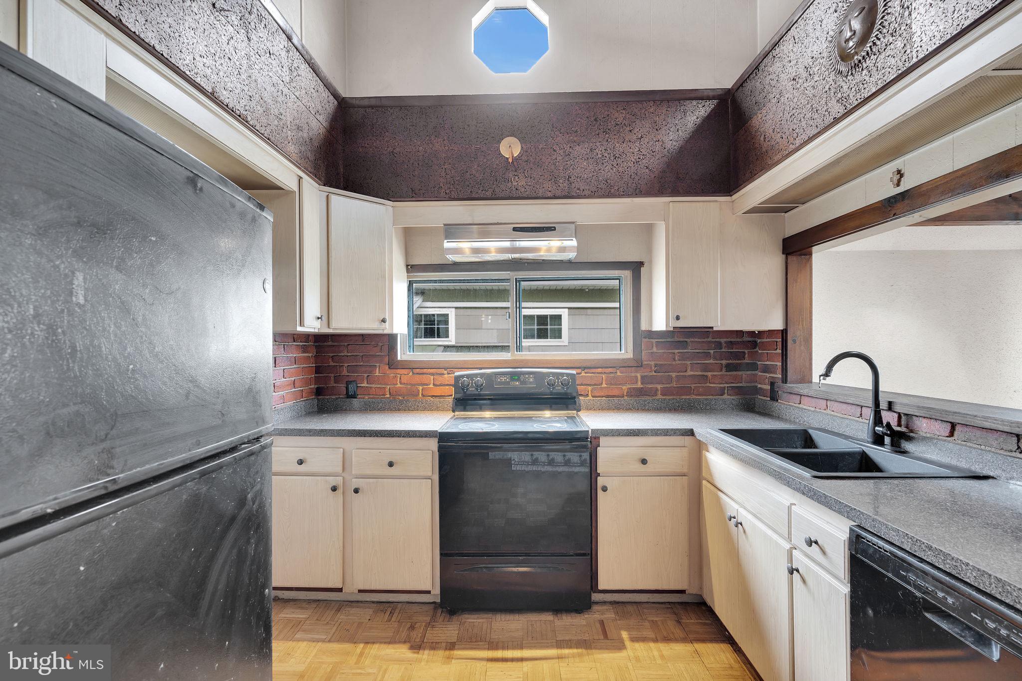 47 South Locust Avenue Salem, NJ 08079 - Photo 14 of 46 a kitchen with a sink stove and cabinets