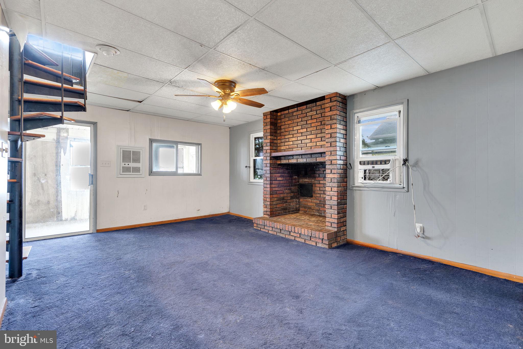 47 South Locust Avenue Salem, NJ 08079 - Photo 19 of 46 an empty room with windows and fireplace