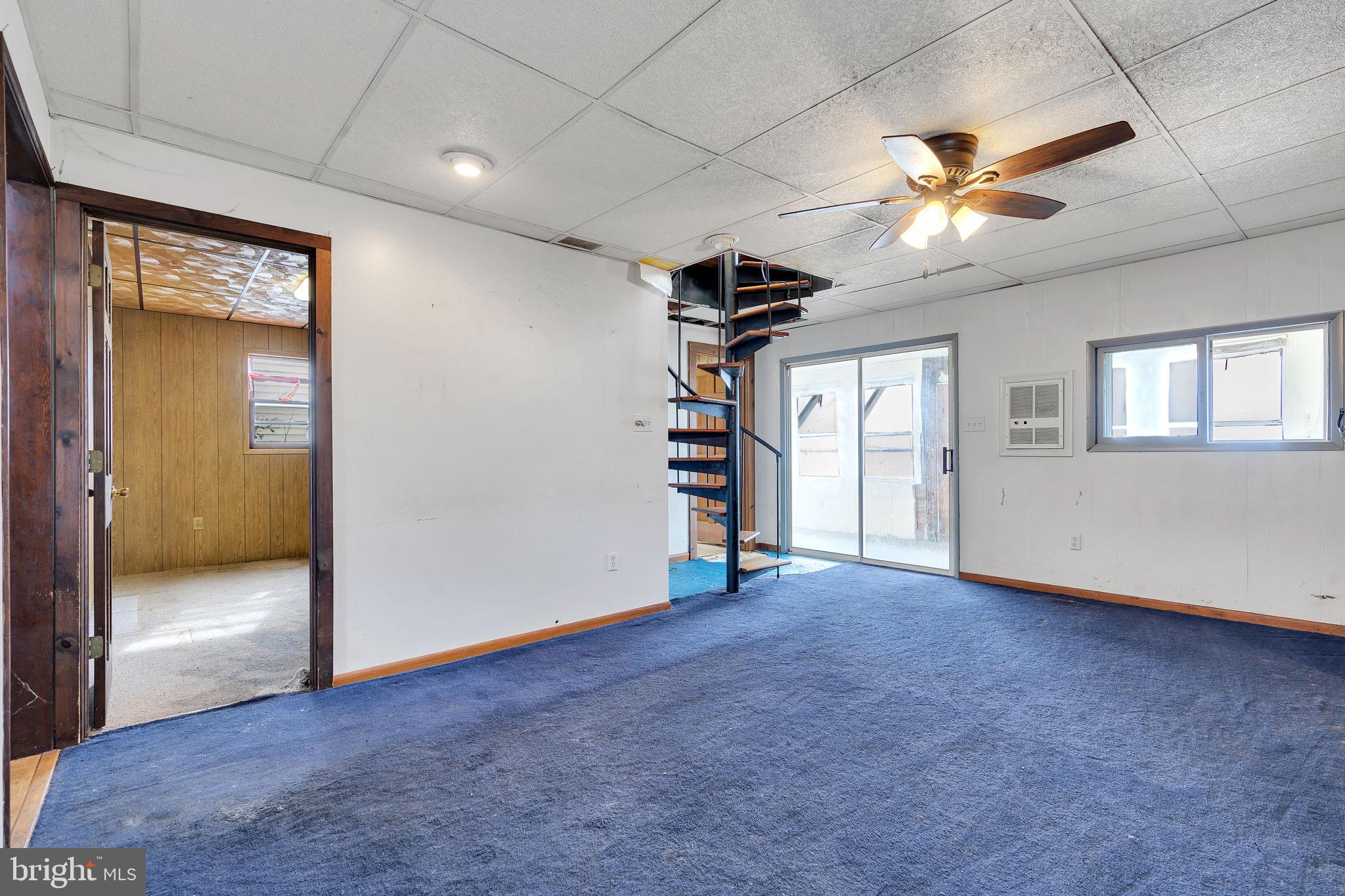 47 South Locust Avenue Salem, NJ 08079 - Photo 21 of 46 an empty room with ceiling fan and windows