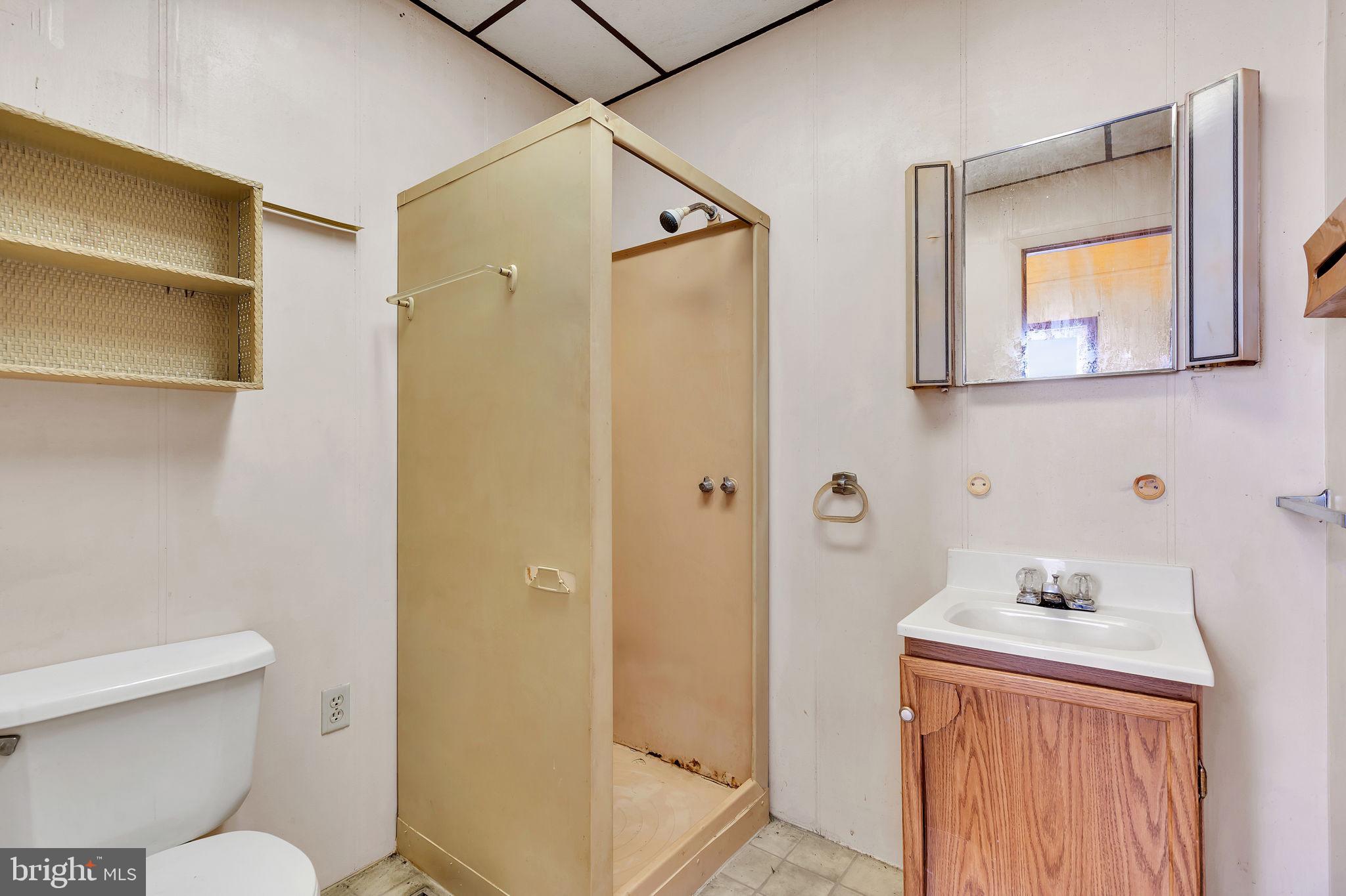 47 South Locust Avenue Salem, NJ 08079 - Photo 30 of 46 a bathroom with a toilet sink and shower