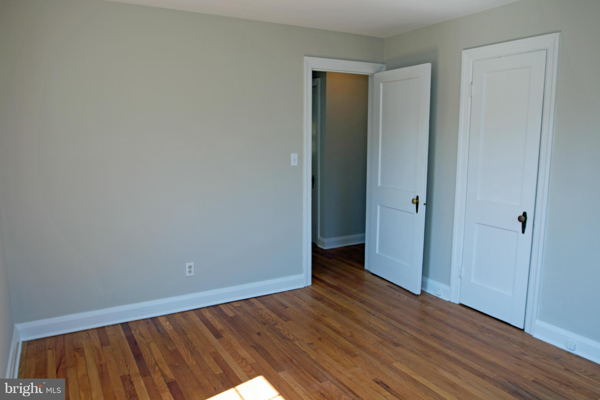 5303 Glen Falls Road Reisterstown, MD 21136 - Photo 13 of 30 a view of an empty room with wooden floor