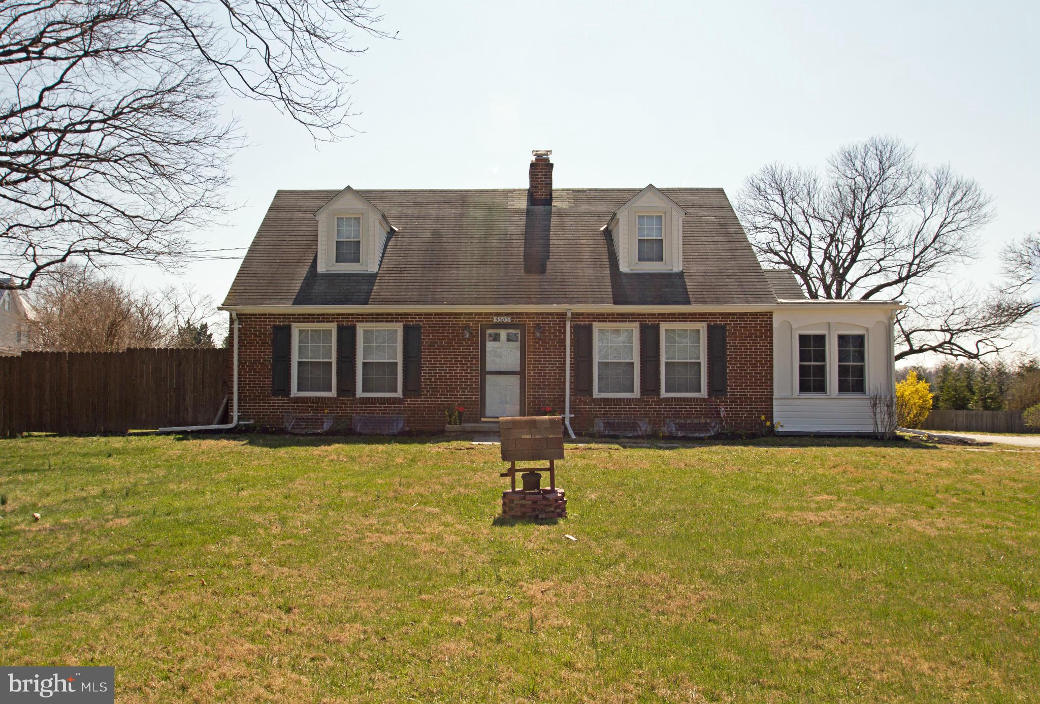 5303 Glen Falls Road Reisterstown, MD 21136 - Photo 22 of 30 a front view of a house with a yard