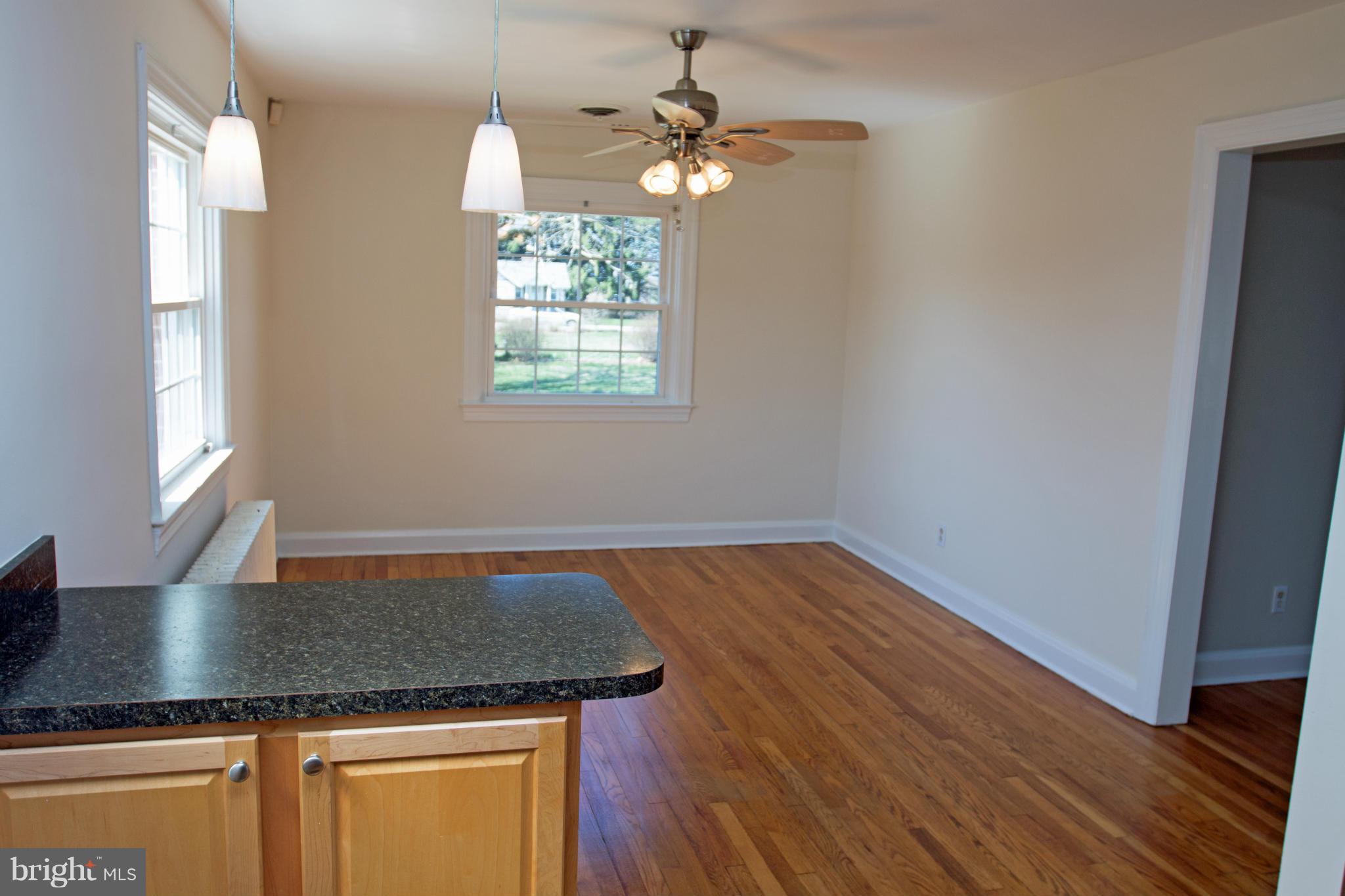 5303 Glen Falls Road Reisterstown, MD 21136 - Photo 4 of 30 wooden floor in an empty room with a window