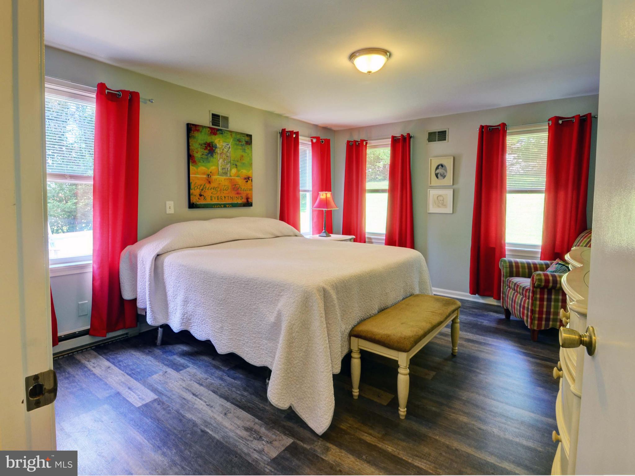 2115 Round Hill Road Fallston, MD 21047 - Photo 14 of 30 a bedroom with a bed and wooden floor