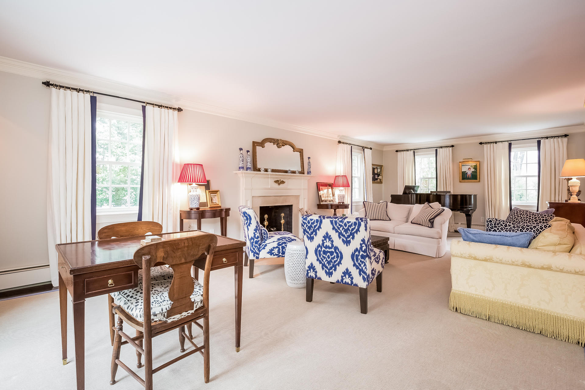 94 Marshall Ridge Road New Canaan, CT 06840 - Photo 14 of 50 a living room with furniture a fireplace and a large window