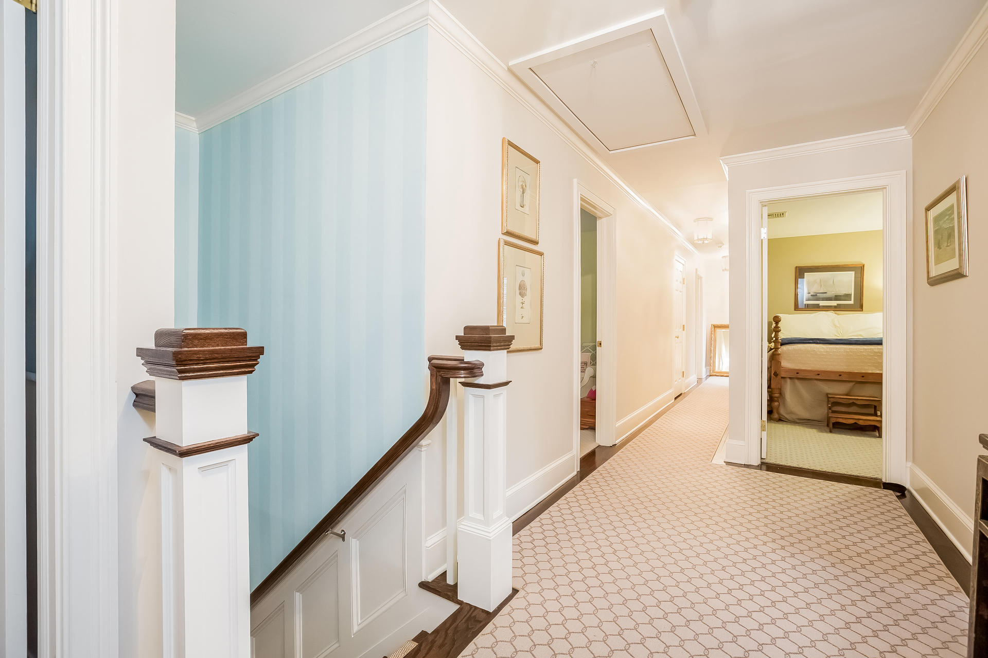 94 Marshall Ridge Road New Canaan, CT 06840 - Photo 16 of 50 a view of a hallway with wooden floor and staircase