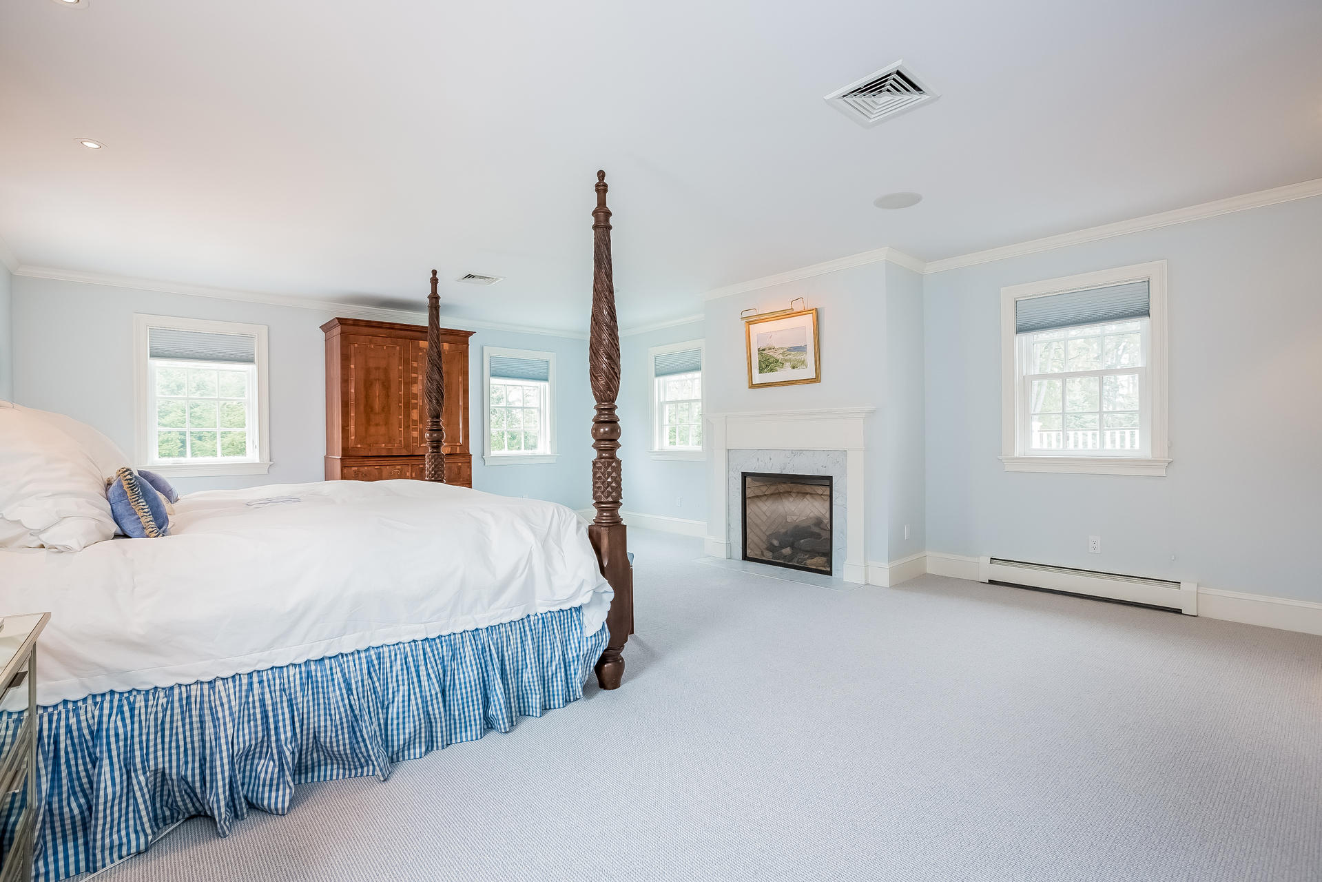 94 Marshall Ridge Road New Canaan, CT 06840 - Photo 17 of 50 a bed room with a bed and a fireplace