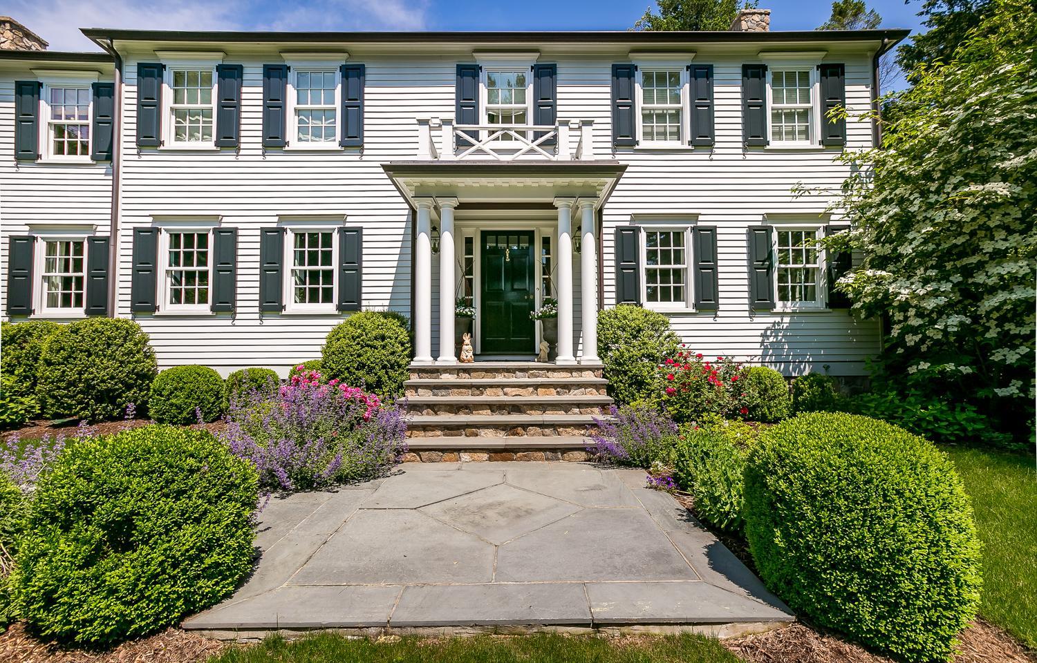 94 Marshall Ridge Road New Canaan, CT 06840 - Photo 2 of 50 front view of a house with a yard