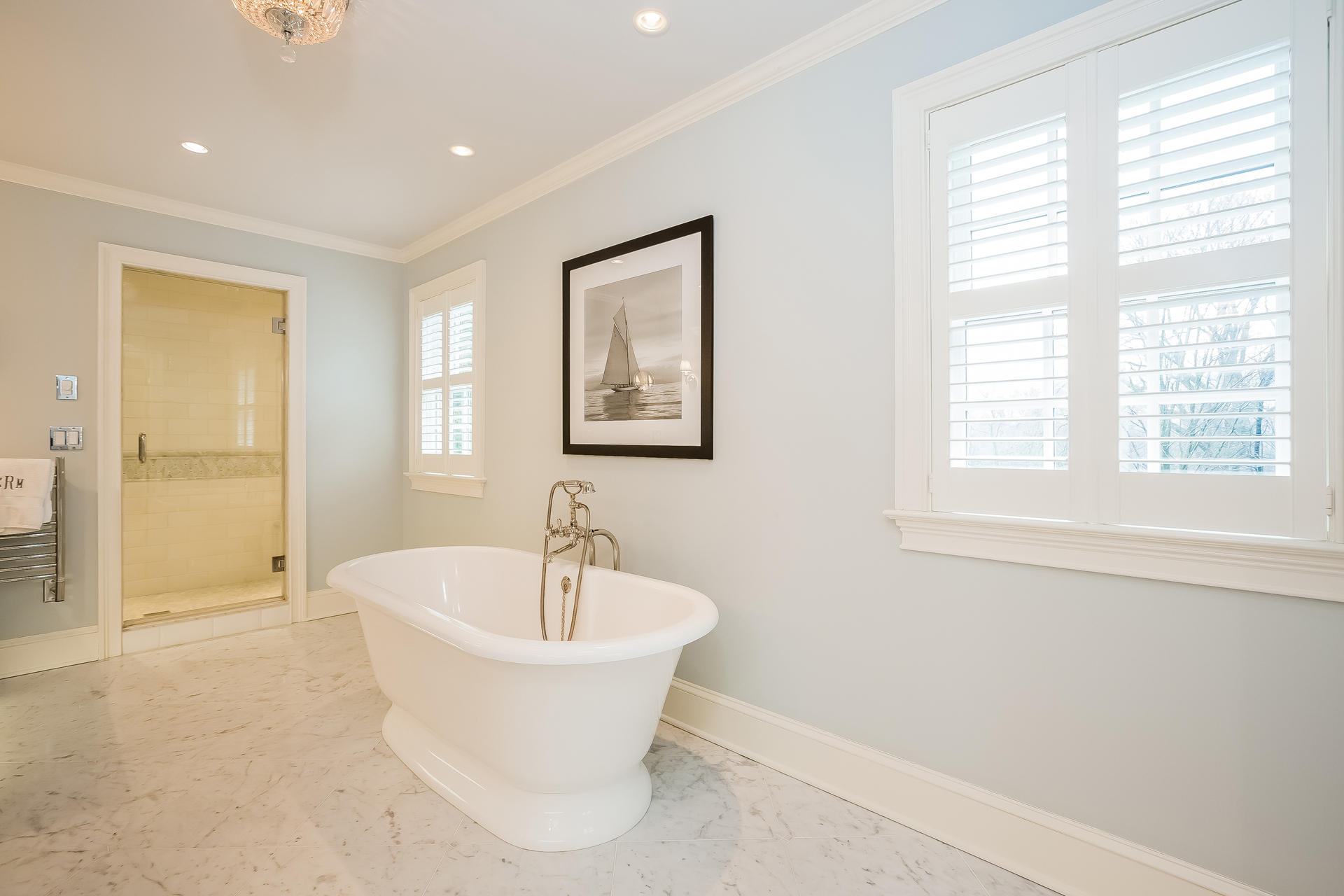 94 Marshall Ridge Road New Canaan, CT 06840 - Photo 21 of 50 a white bath tub sitting in a spacious bathroom next to a window