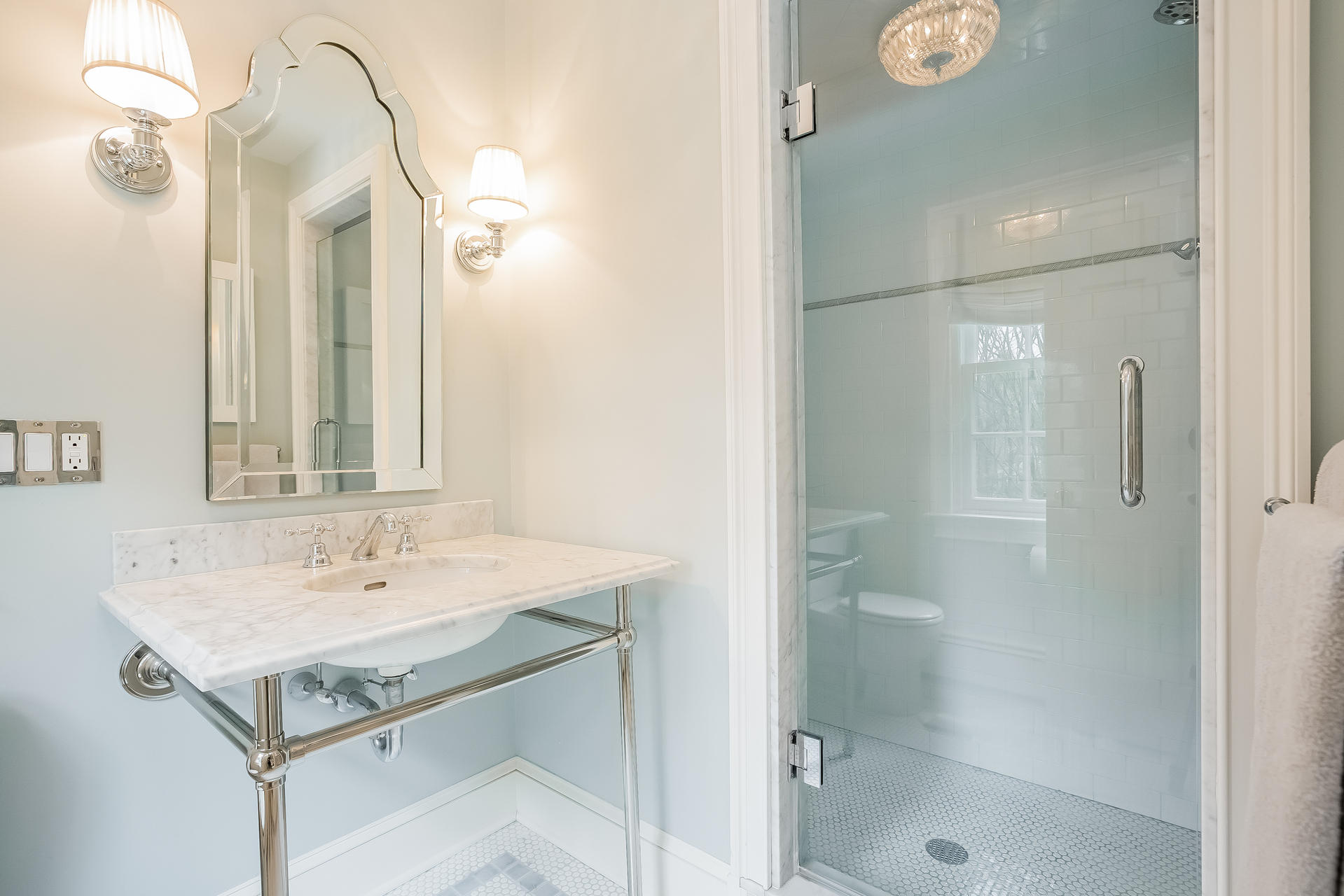 94 Marshall Ridge Road New Canaan, CT 06840 - Photo 25 of 50 a bathroom with a sink a mirror and a shower