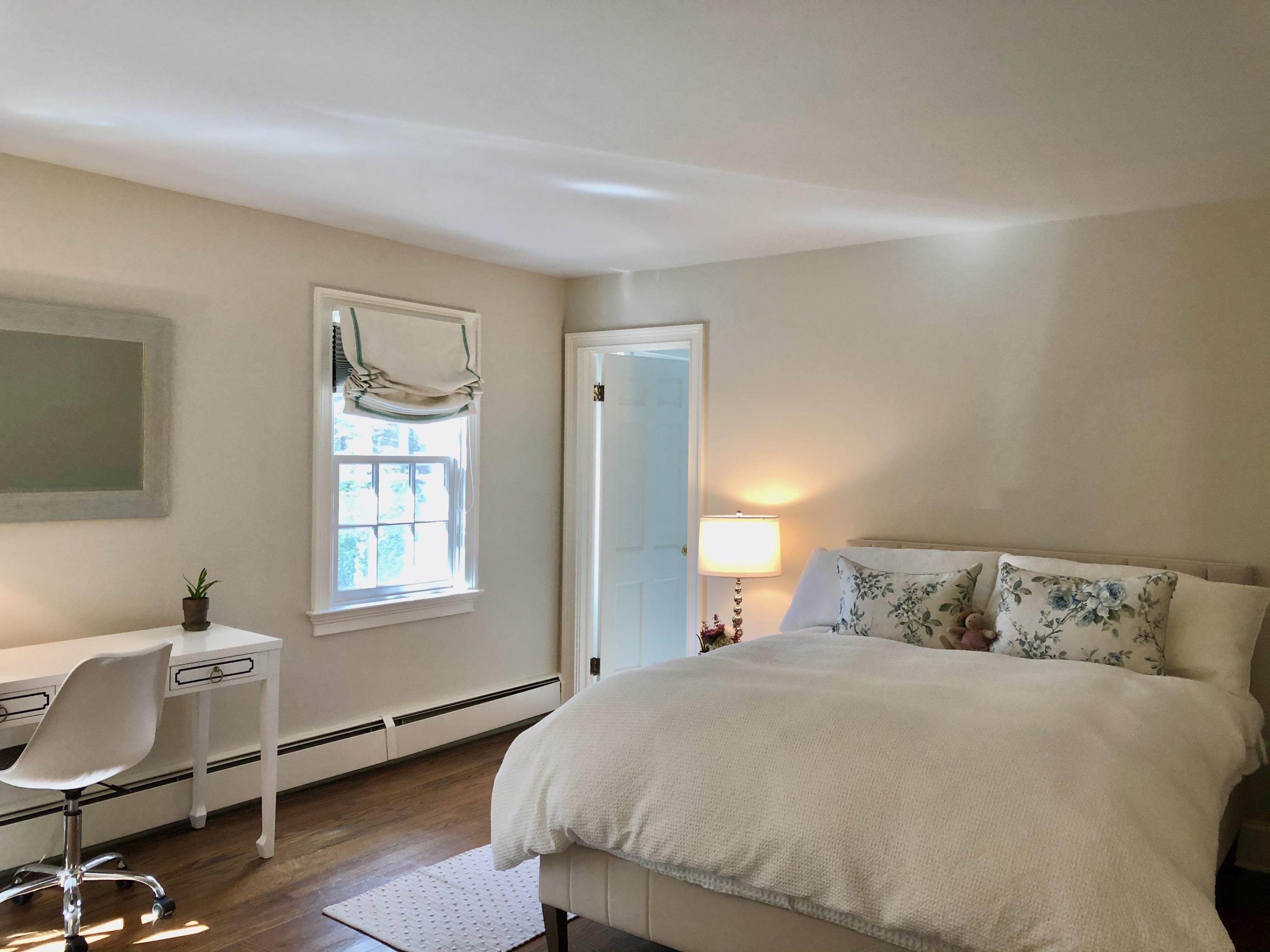 94 Marshall Ridge Road New Canaan, CT 06840 - Photo 27 of 50 a bedroom with a bed and wooden floor