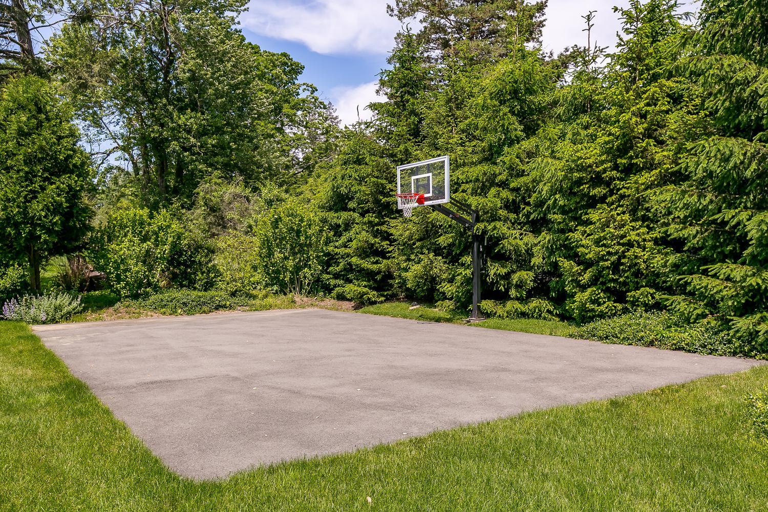 94 Marshall Ridge Road New Canaan, CT 06840 - Photo 41 of 50 a view of a backyard with a garden