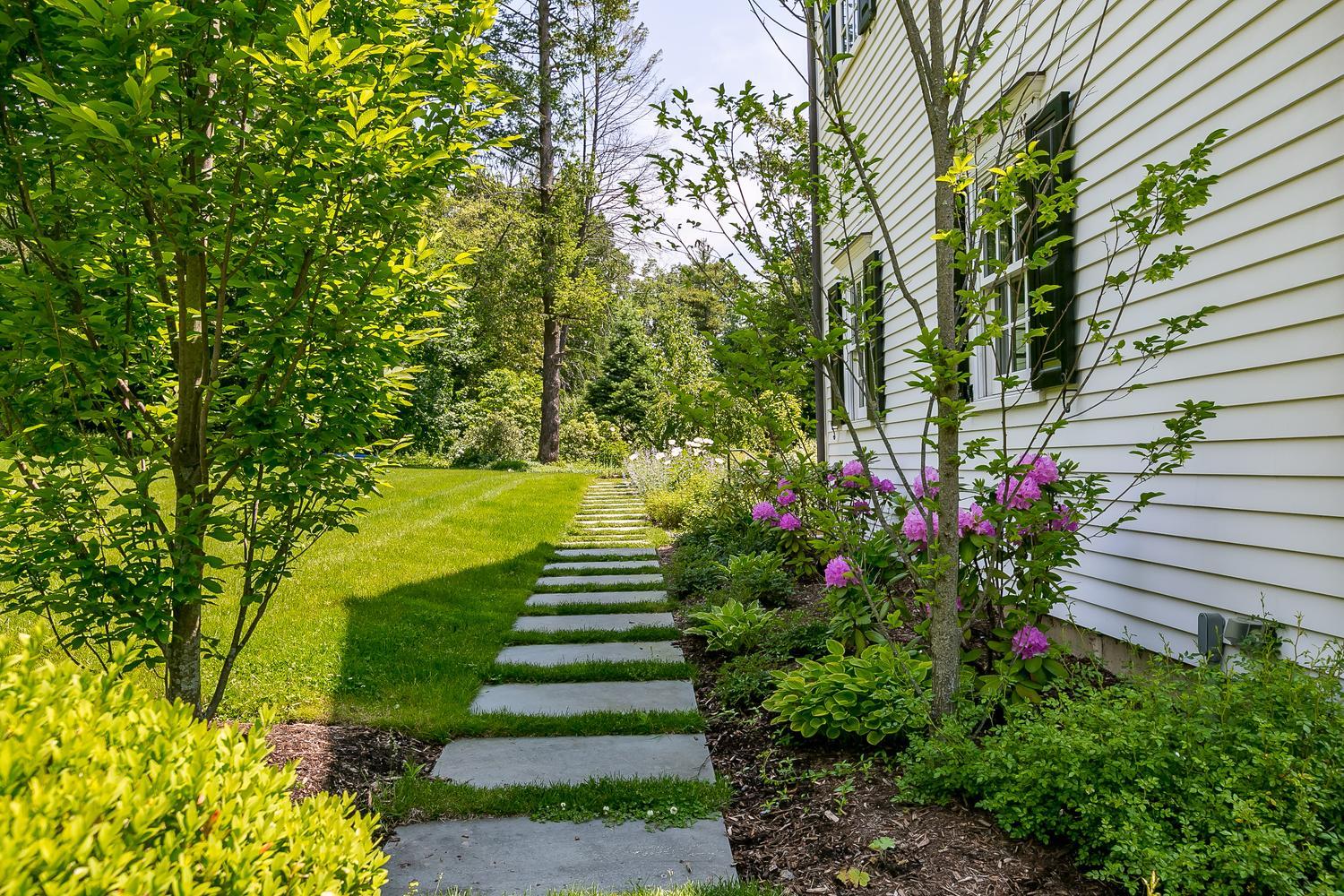 94 Marshall Ridge Road New Canaan, CT 06840 - Photo 43 of 50 a view of a garden with flowers
