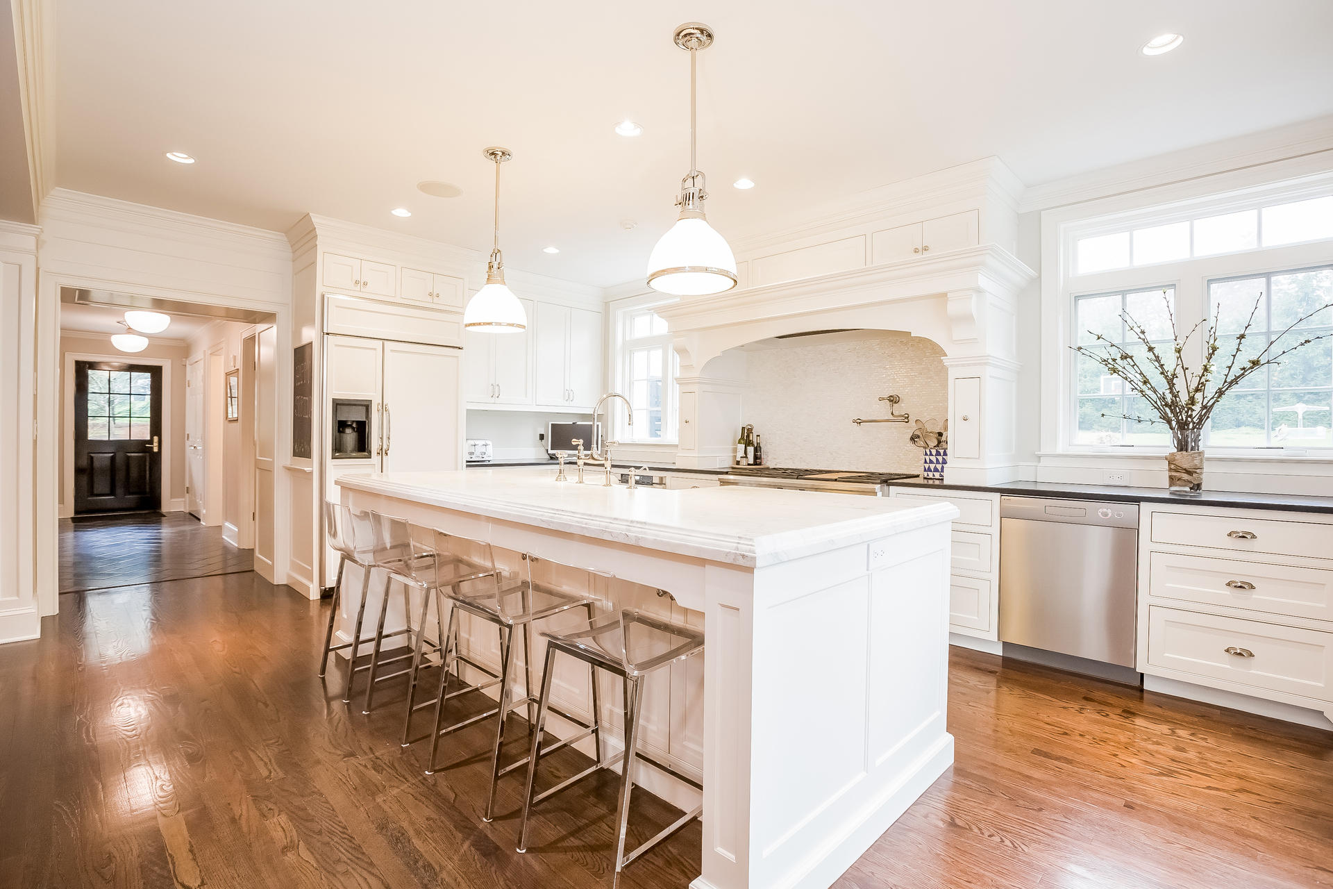 94 Marshall Ridge Road New Canaan, CT 06840 - Photo 6 of 50 a kitchen with kitchen island a sink and a stove top oven