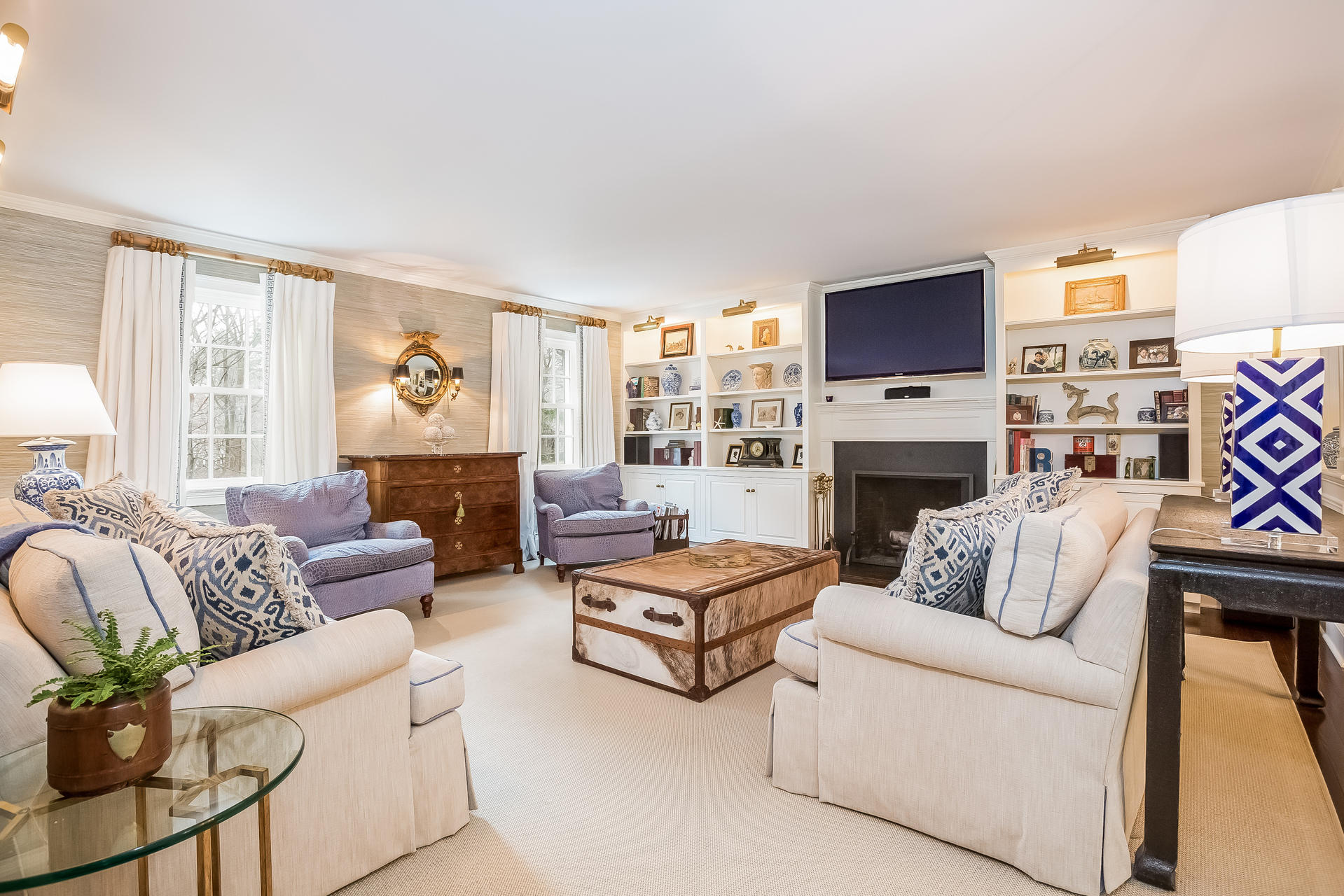 94 Marshall Ridge Road New Canaan, CT 06840 - Photo 8 of 50 a living room with fireplace furniture and a flat screen tv