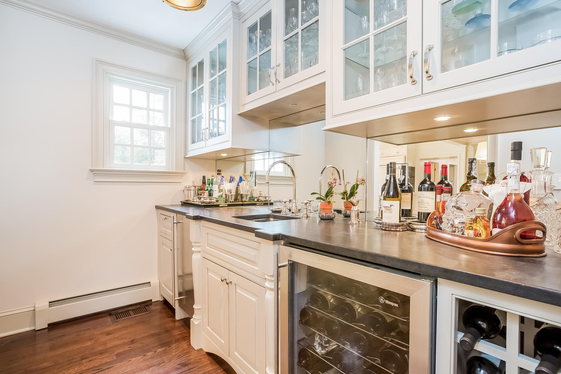 94 Marshall Ridge Road New Canaan, CT 06840 - Photo 9 of 50 a kitchen with stainless steel appliances granite countertop a sink and dishwasher with wooden floor